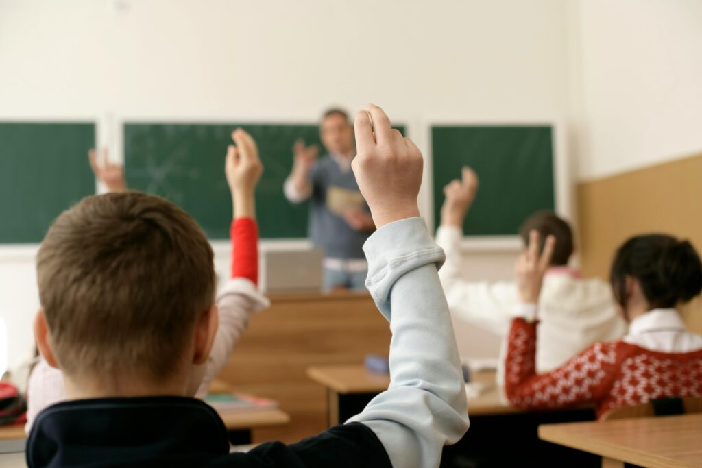 School volunteer teaching a classroom of students