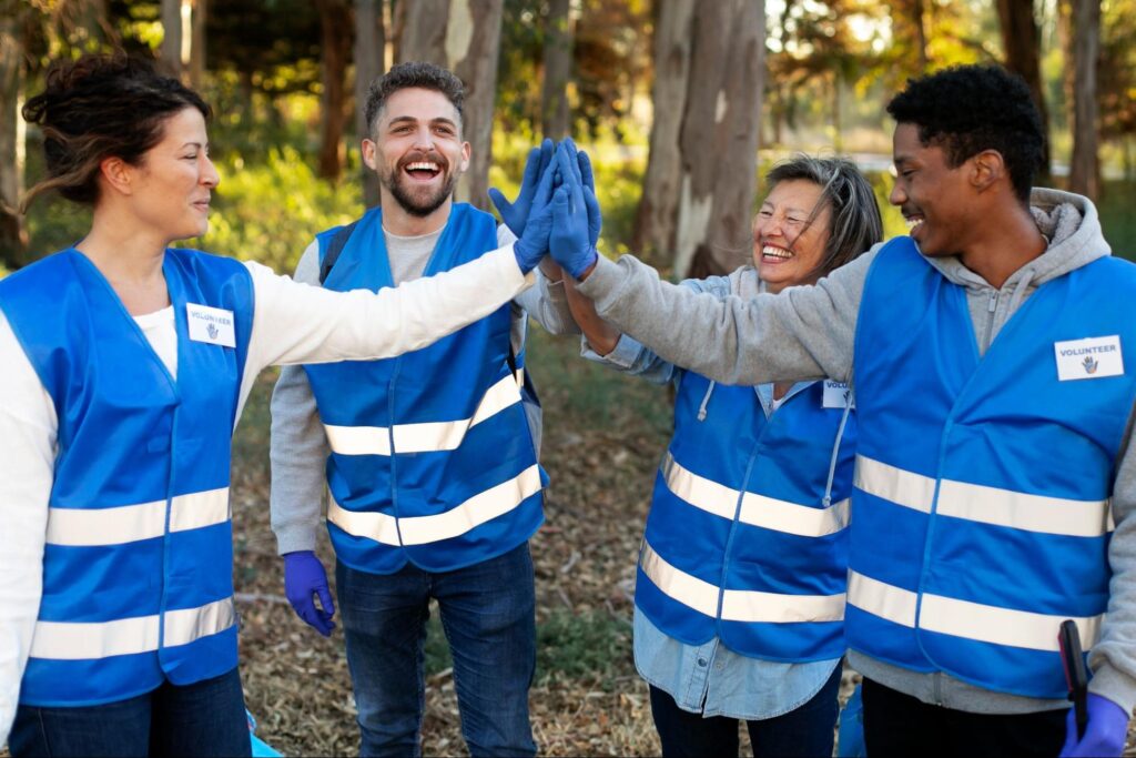 volunteer giving high five after volunteering for long hour