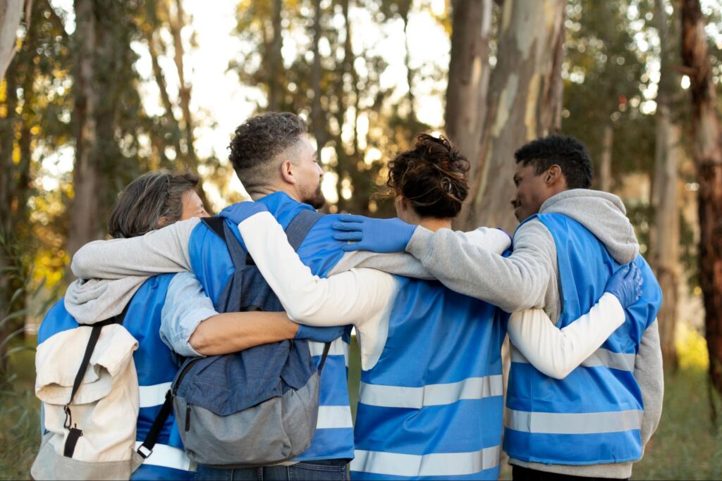 group of volunteerscheering each other
