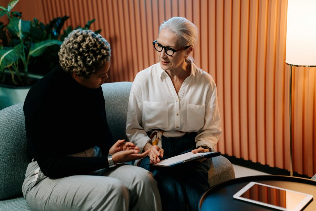Older woman working with a new volunteer