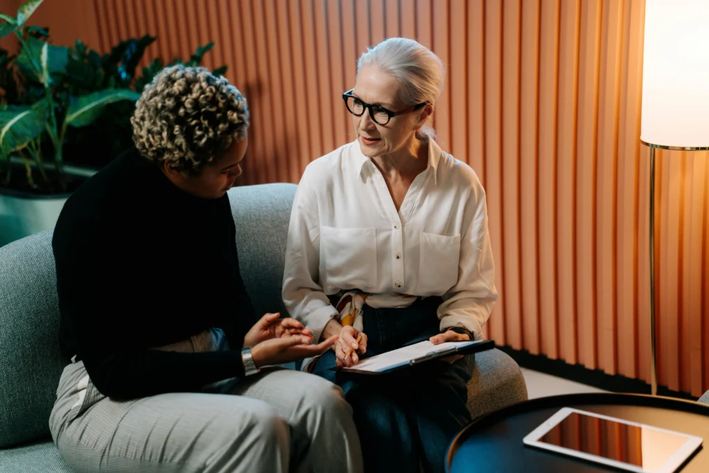 Older woman working with a new volunteer