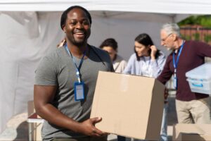 volunteer holding a box