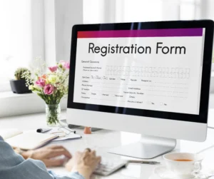 A desktop screen displaying a registration form. A person is trying to fill out the online form.